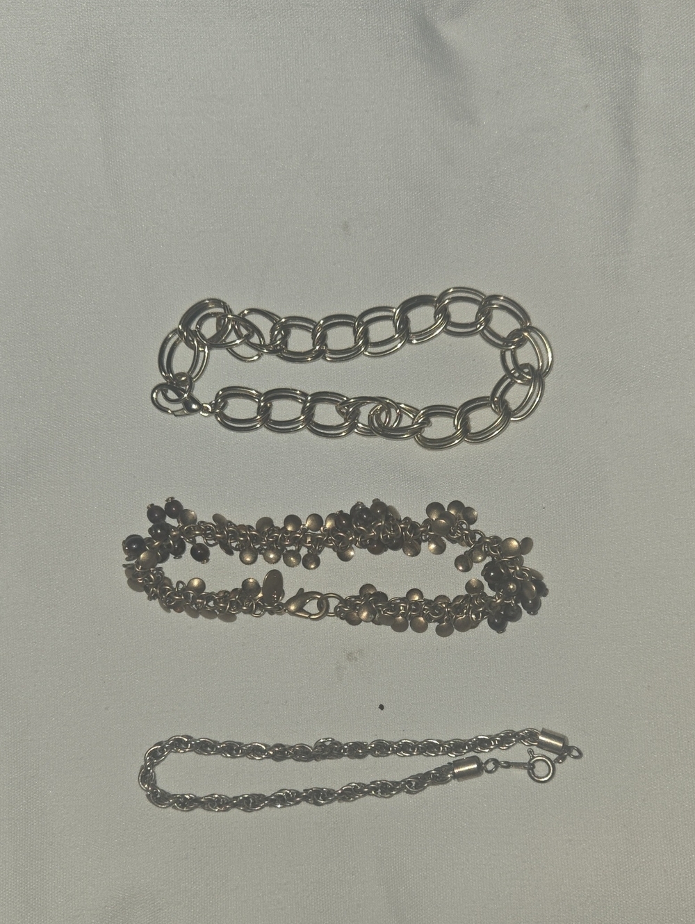 3 gold bracelets And Pin
